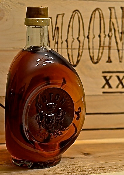 bottle of homemade brandy moonshine